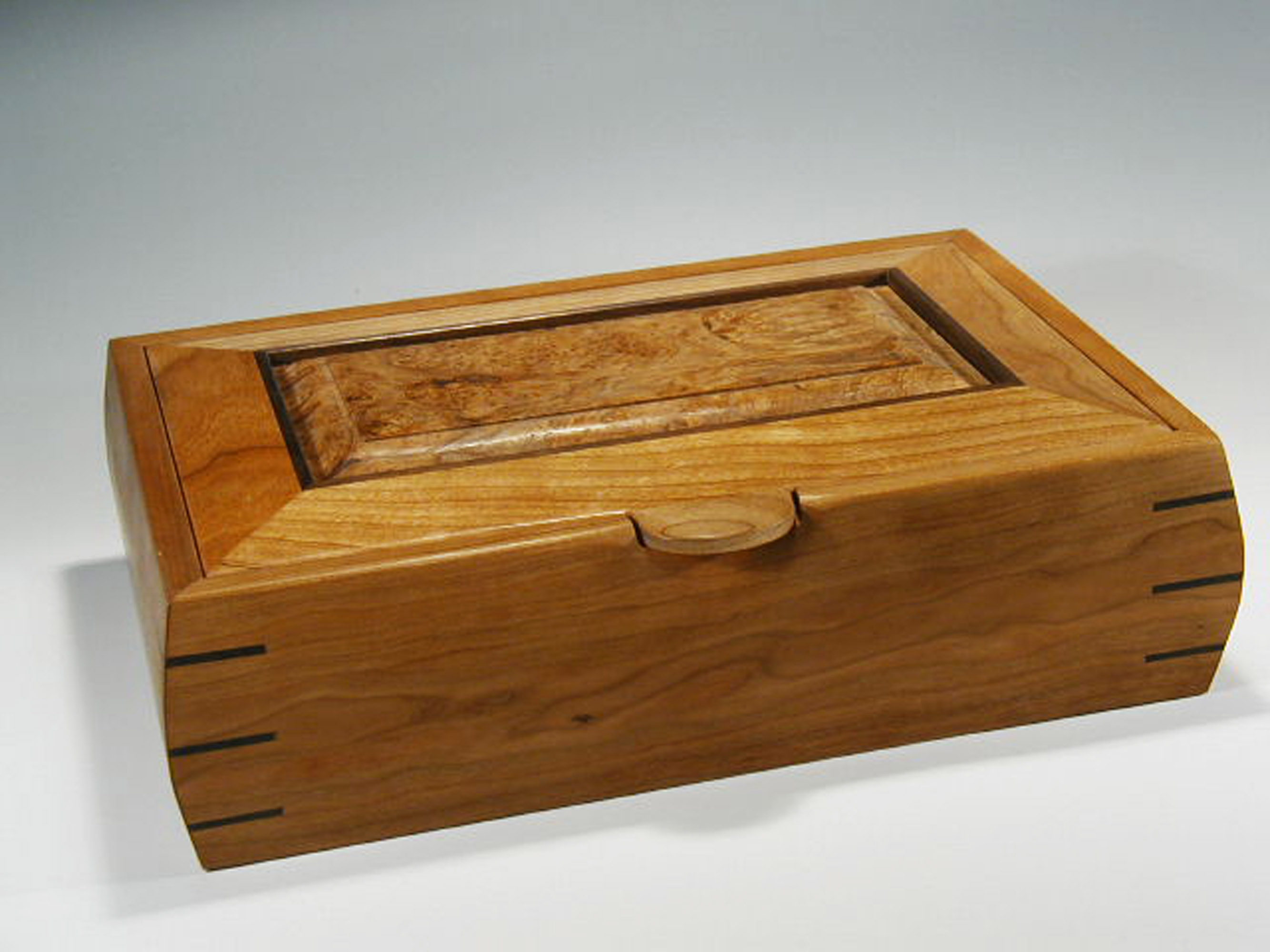 This is one of my handmade wooden boxes that can be used as a watch jewelry box; it is made of cherry wood.